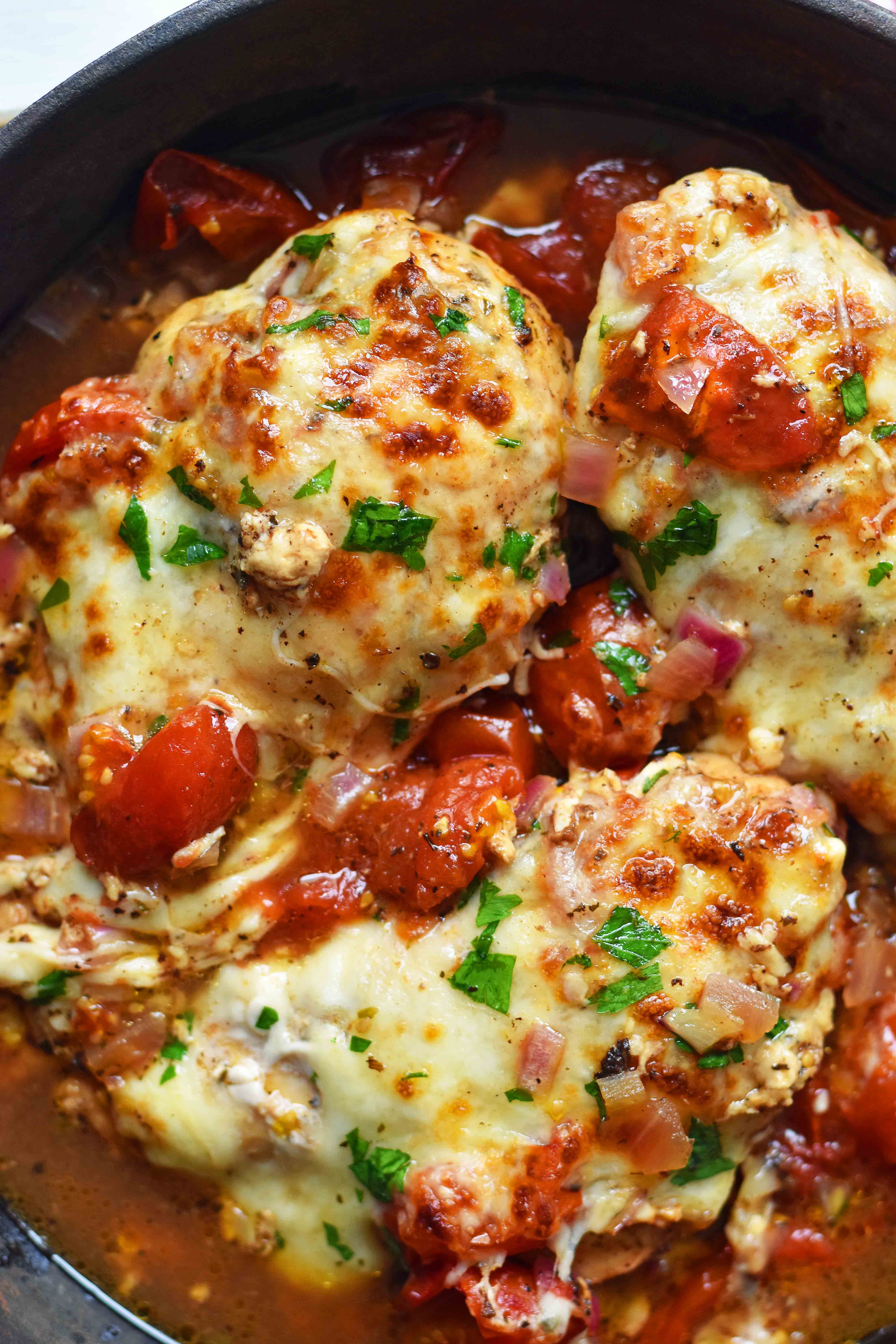 Baked Chicken Caprese. Oven-roasted chicken with Italian spices, sweet balsamic tomatoes, and melted mozzarella cheese. An easy 30-minute meal that your whole family will love. Chicken Breast with oven-roasted tomatoes and fresh mozzarella. www.modernhoney.com #dinner #30minutemeals #chicken