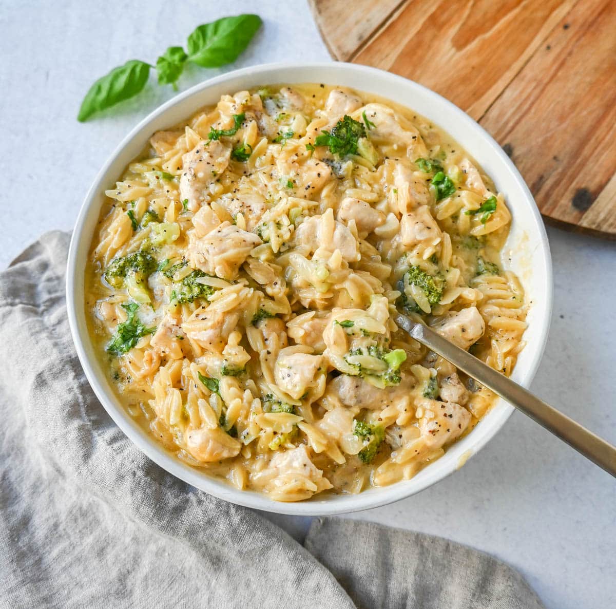 Creamy Chicken Broccoli Orzo made with sauteed chicken, fresh broccoli, orzo pasta in a cheesy sauce. This easy Cheesy Chicken Broccoli Orzo Skillet 30-minute meal is creamy and delicious!