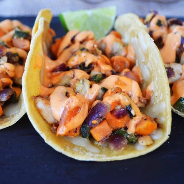Chicken Poblano Sweet Potato Tacos with Chipotle Cream. Flavorful and slightly spicy chicken and veggies tacos on corn tortillas. www.modernhoney.com #mexicanfood #mexican #tacos #taco