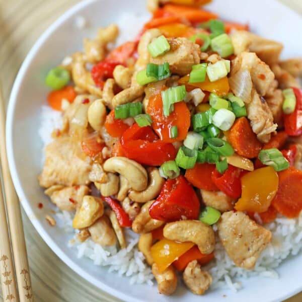 Honey Cashew Chicken. A healthier version of a popular Asian dish -- Cashew Chicken.  Gluten-Free. Dairy-Free. Sugar-Free.  A spicy and sweet chicken with crisp vegetables in a flavorful sauce.  www.modernhoney.com #honeycashewchicken #cashewchicken #chinesechicken #asianfood