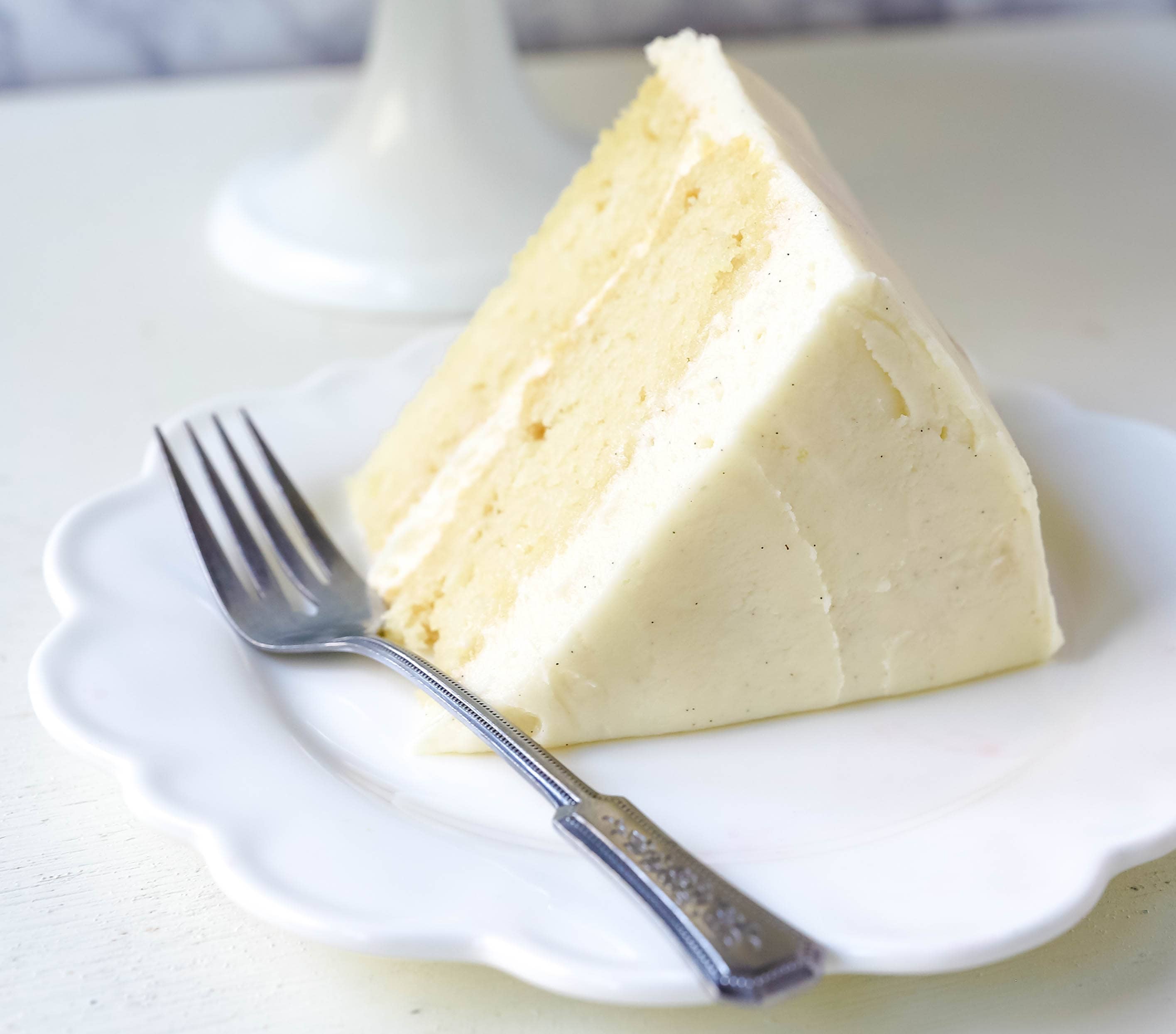Vanilla Cake Recipe. The best homemade vanilla cake recipe with vanilla bean buttercream frosting. www.modernhoney.com #vanillacake #cake #cakerecipe #vanillacakerecipe