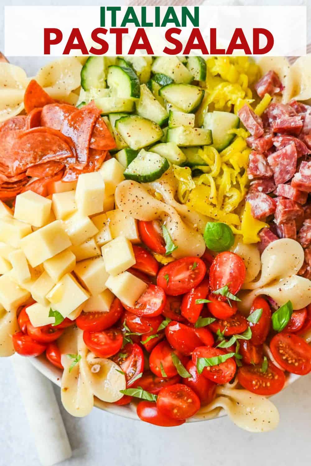 How to make the best pasta salad with Italian meats, cheese, pasta, and vegetables, all tossed with a homemade creamy red wine vinaigrette. This is such an easy, popular pasta salad recipe.