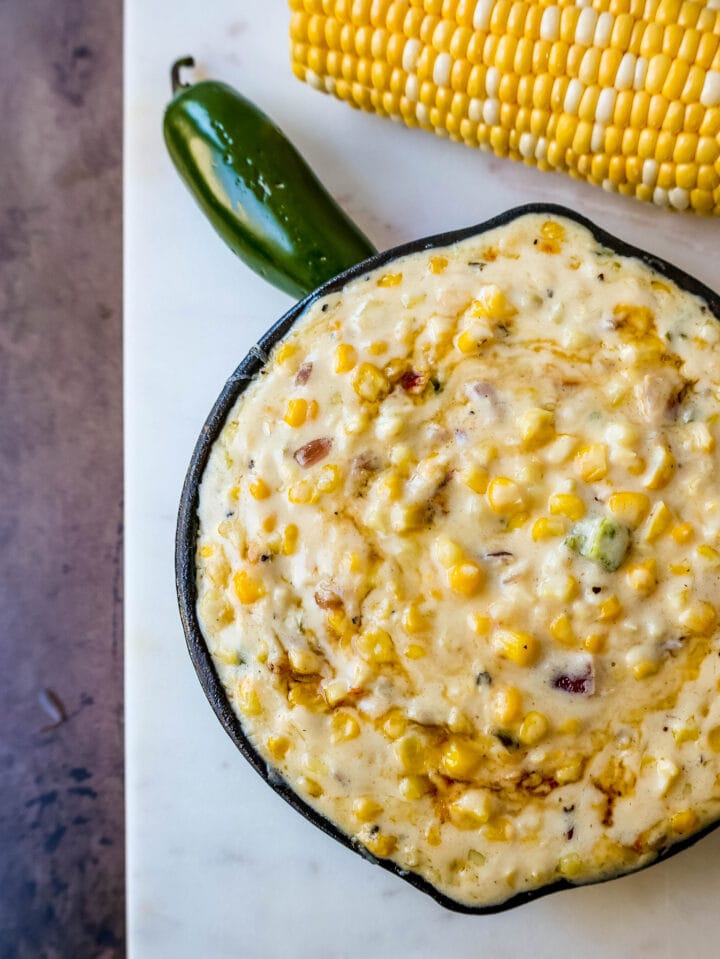 This Southwest Creamed Corn is made with white corn, sauteed with jalapenos and onions, and cooked with heavy cream and pepper jack cheese. The perfect creamed corn recipe with so much flavor!