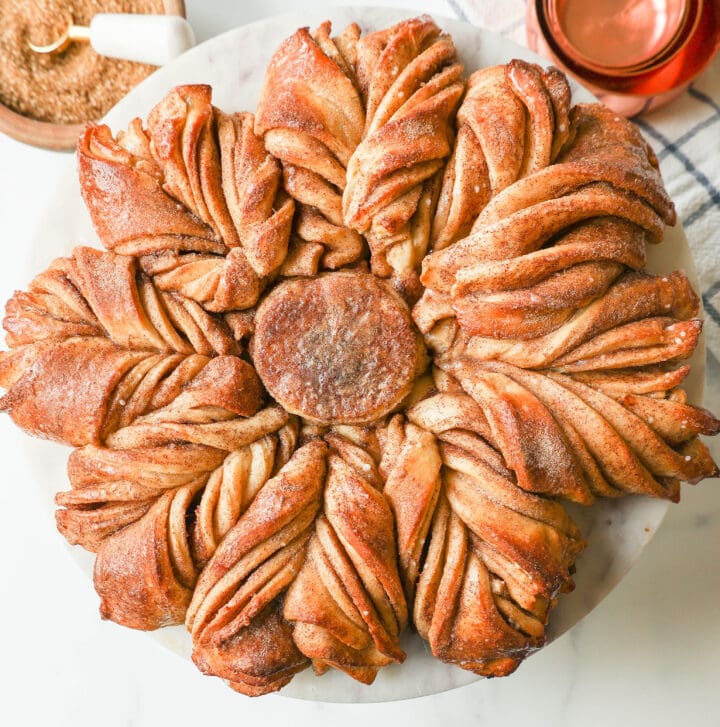 This Star Bread is a pull-apart bread that is perfectly soft and fluffy and filled with your favorite fillings. This is a Cinnamon Sugar Star Bread with layers of butter, cinnamon, and sugar, and shaped into a beautiful star.
